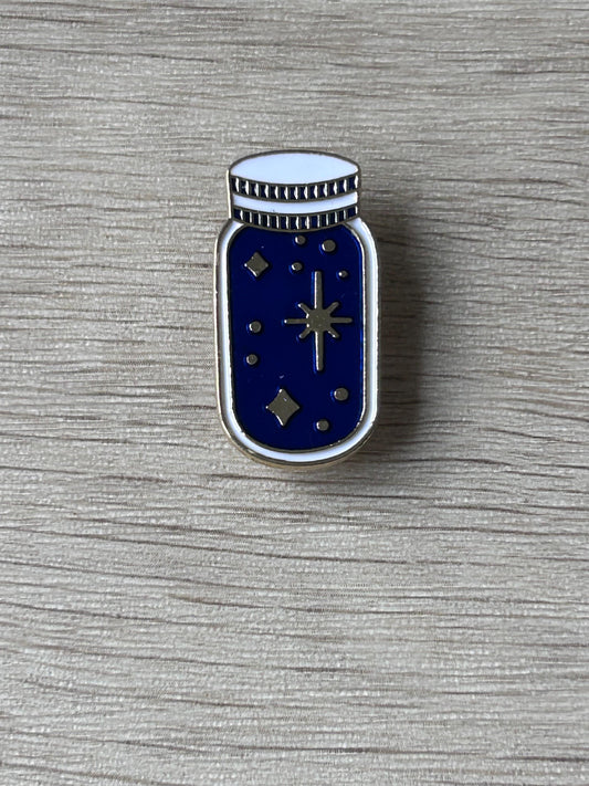 Pin's bocal bleu étoilé avec détails dorés