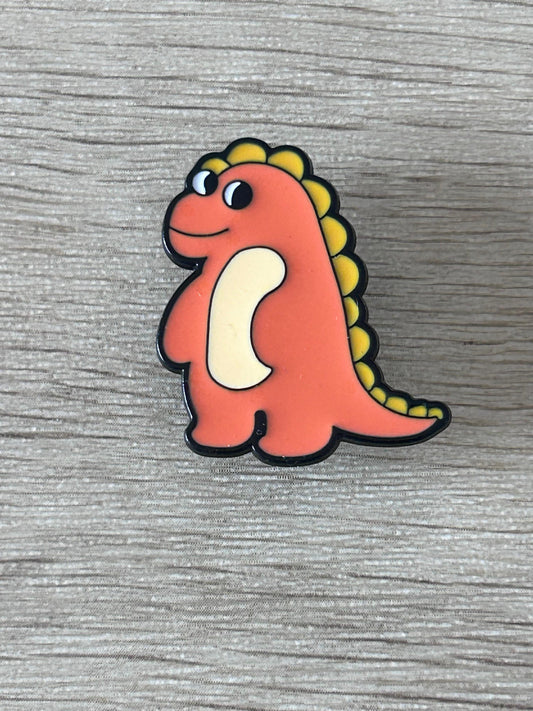 Épingle dinosaure orange kawaii, crête jaune et patte blanche