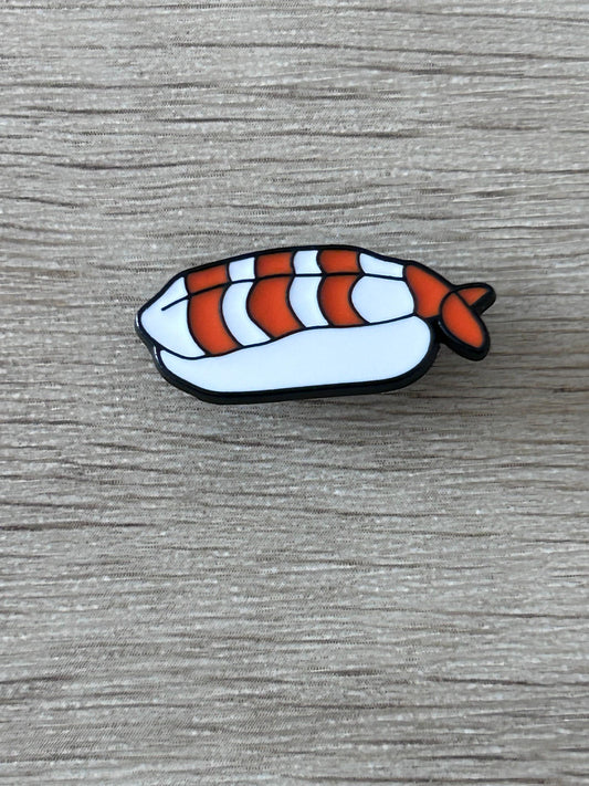 Pin's en forme de nigiri de crevette, blanc, stries bleues, queue orange