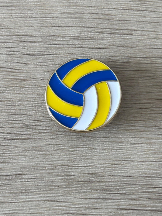 Épinglette ballon de volley-ball bleu et jaune, motif ondulé, bord argenté.