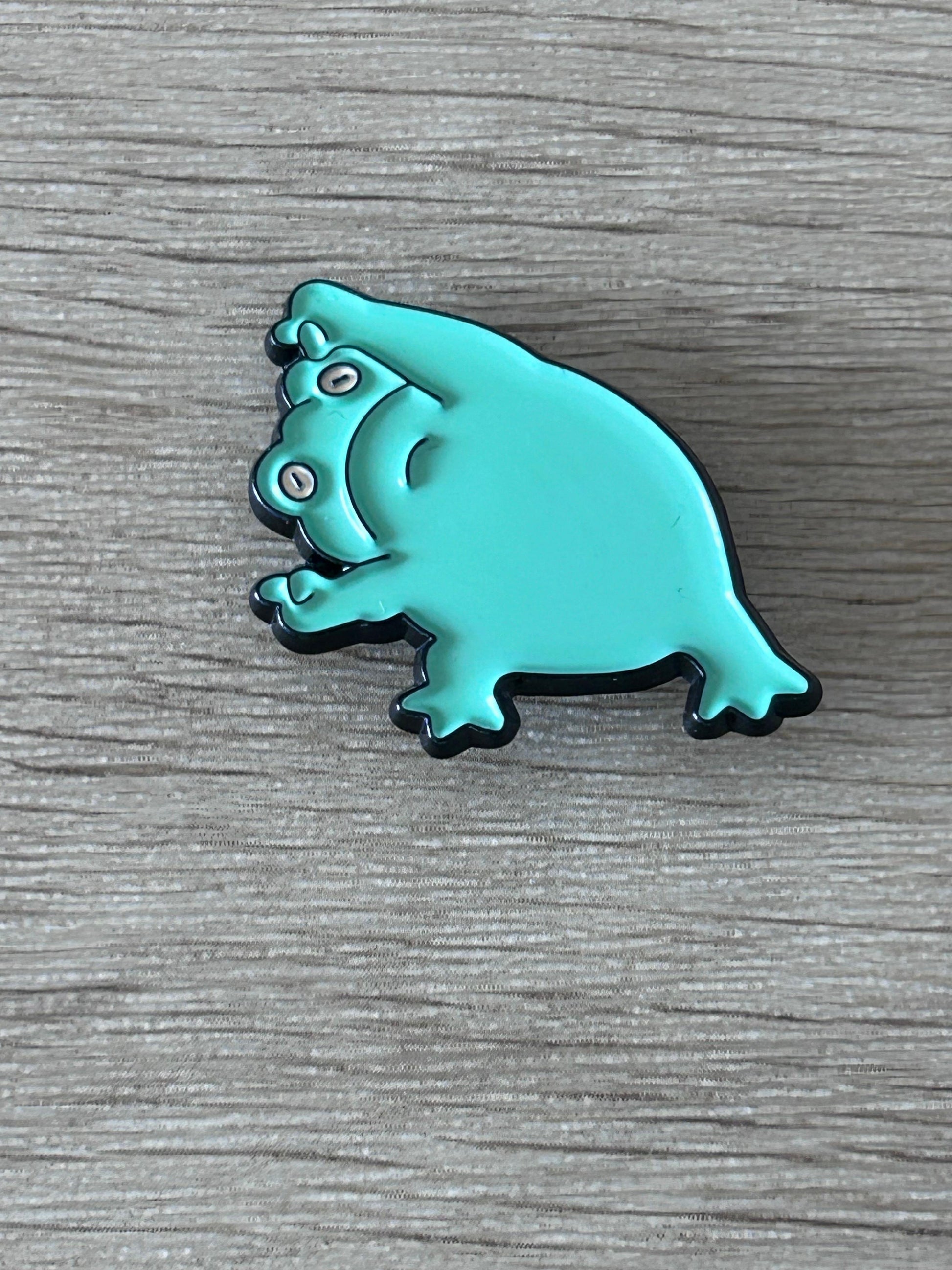 Épingle grenouille turquoise, vue de profil