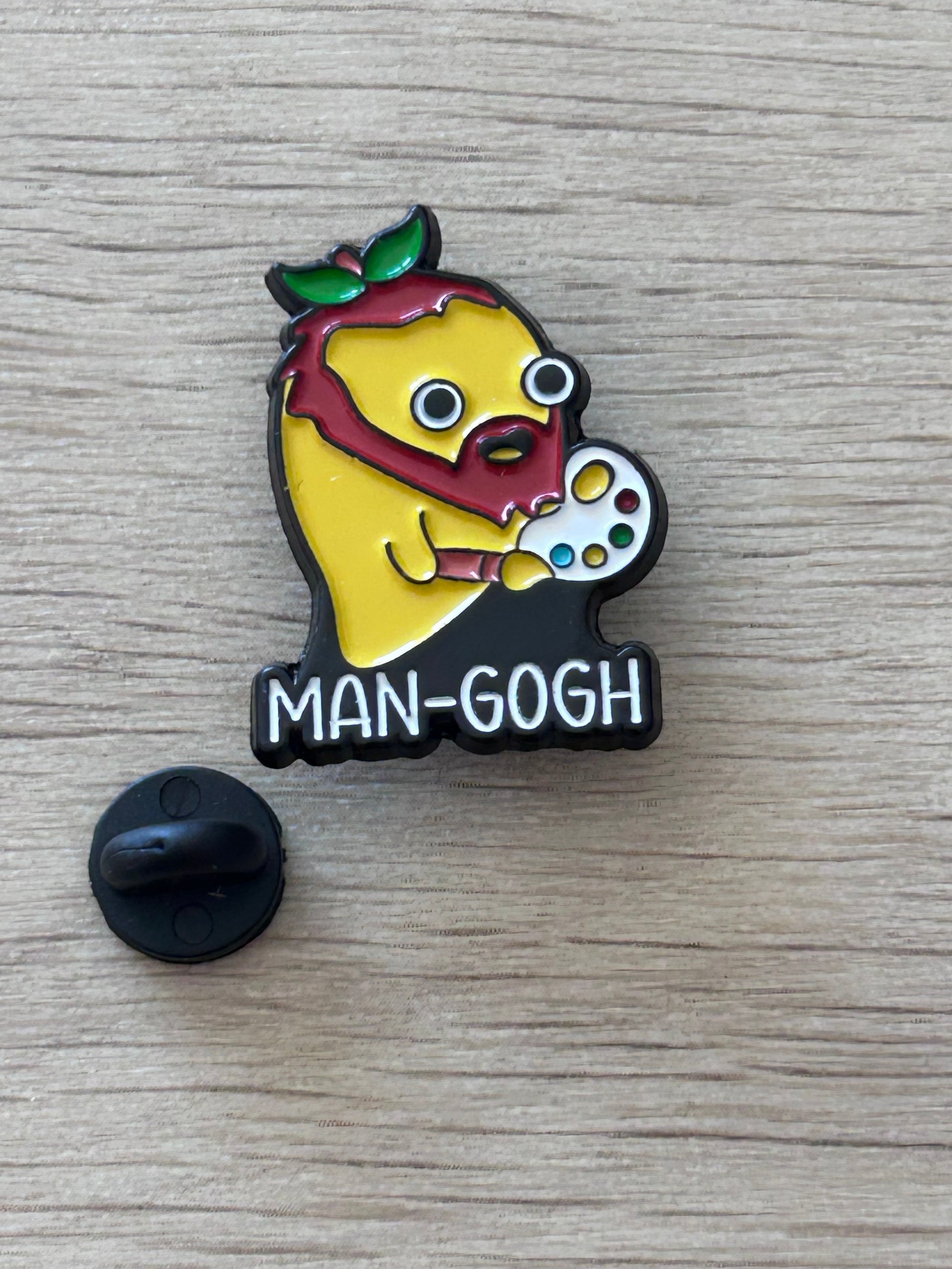 Pin's Man-Gogh avec palette de peinture et béret de feuilles vertes