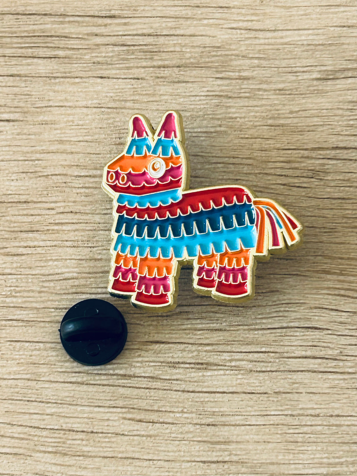 Pin's âne piñata multicolore avec attache noire